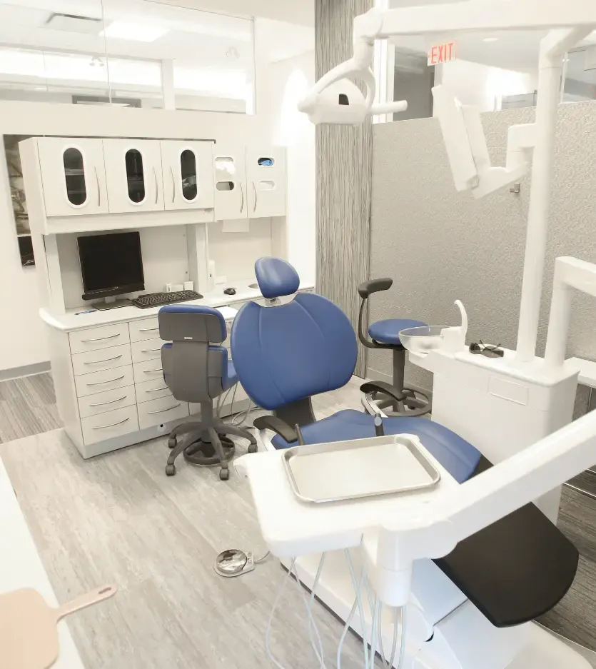 Treatment room with a blue dental chair