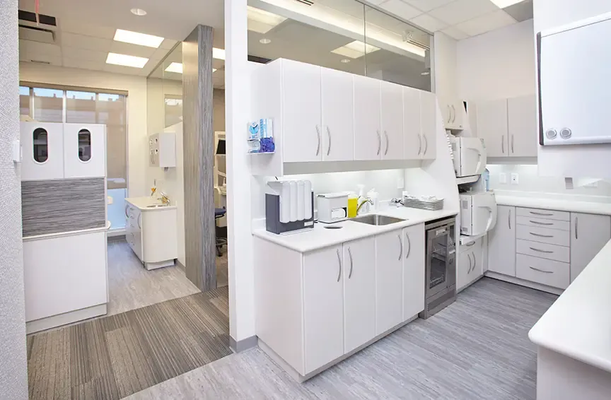 Sterilization room with white cabinets and counters