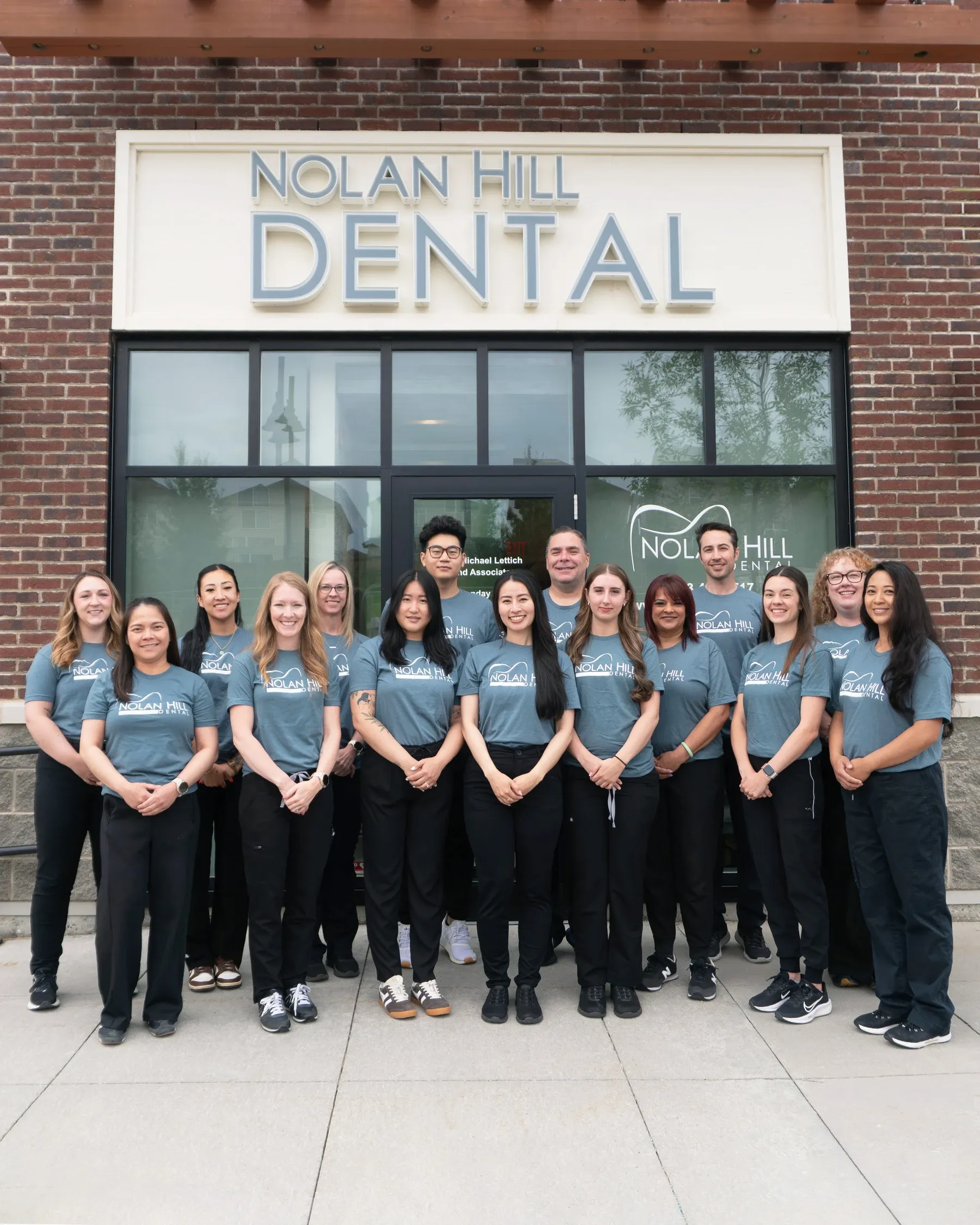 The Nolan Hill Dental team standing outside the clinic